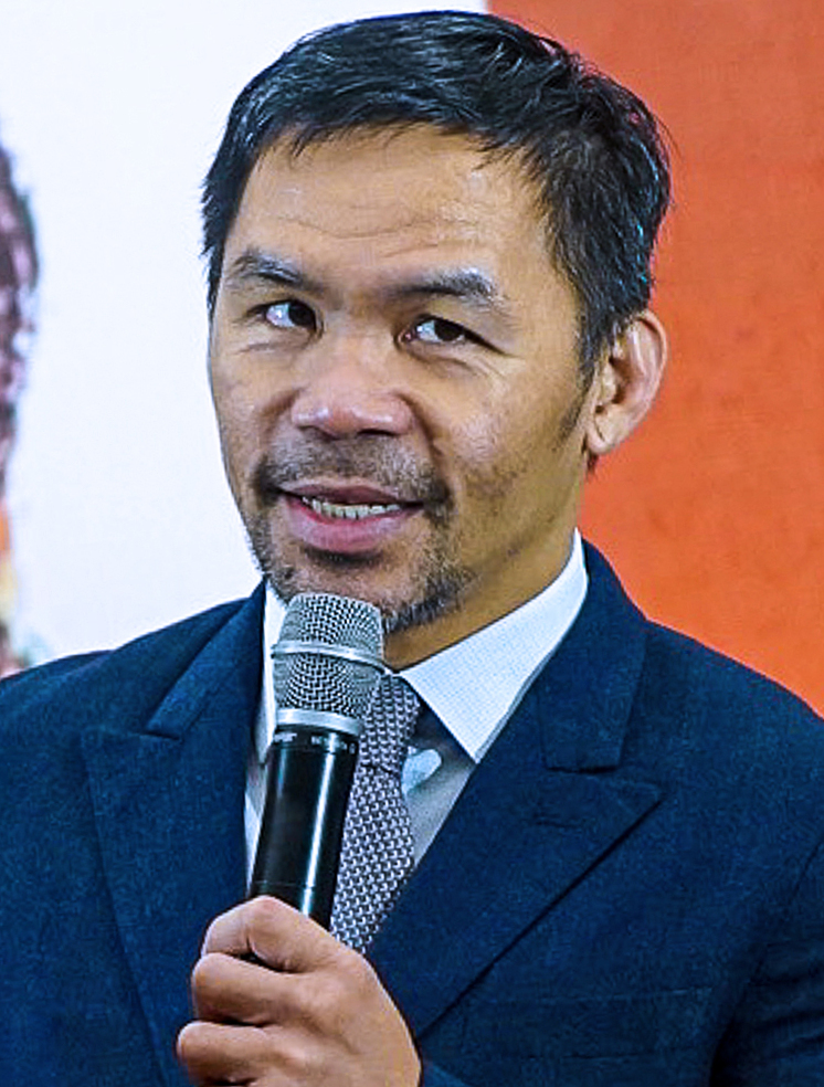 manny pacquiao speaking at a 2025 event in quezon city