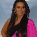 kyle richards net worth, career, family & relationships 10 archival photograph of kyle richards at an nbc tca party, wearing a pink dress and black scarf