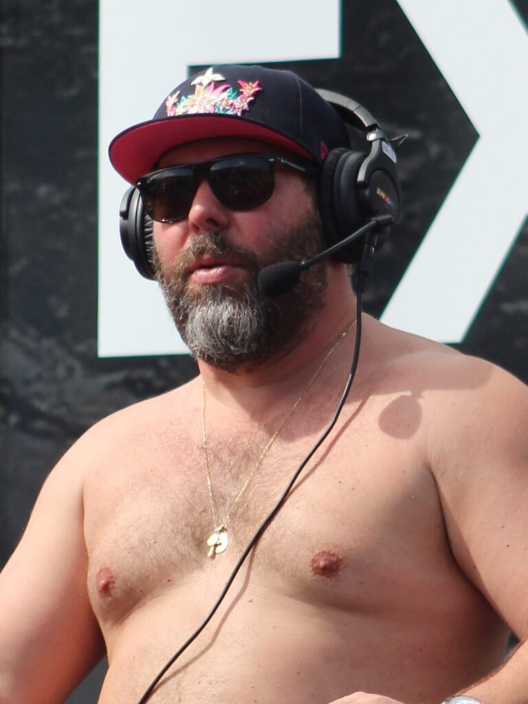 bert kreischer wearing a headset at the 2023 daytona 500
