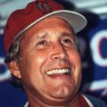chevy chase wearing a red cap at earth day in washington, d.c., 2000