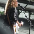 sheryl crow performing with guitar at the 2019 indianapolis 500