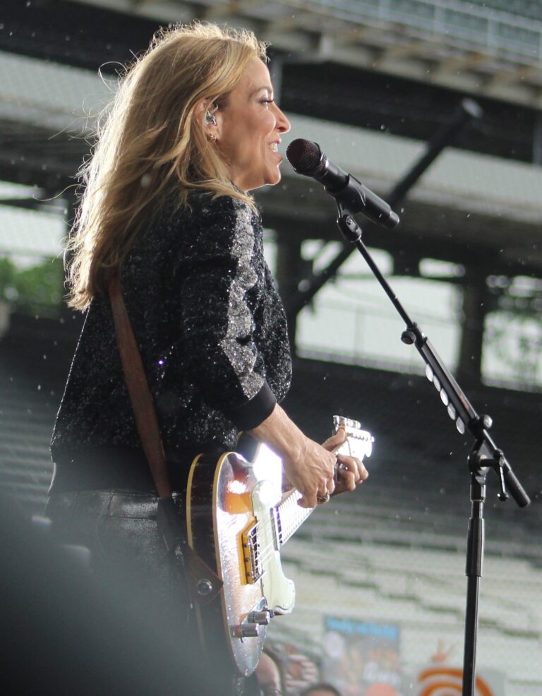 sheryl crow net worth: catalog sale, music & family 1 sheryl crow performing with guitar at the 2019 indianapolis 500