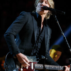 Keith Urban performing with a guitar in 2020